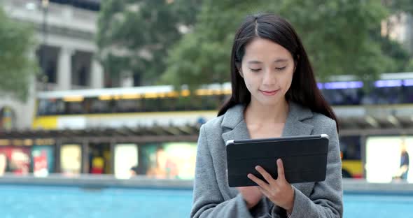 Woman working on tablet computer