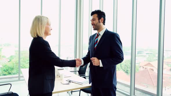 Business People Handshake with Friend at Office