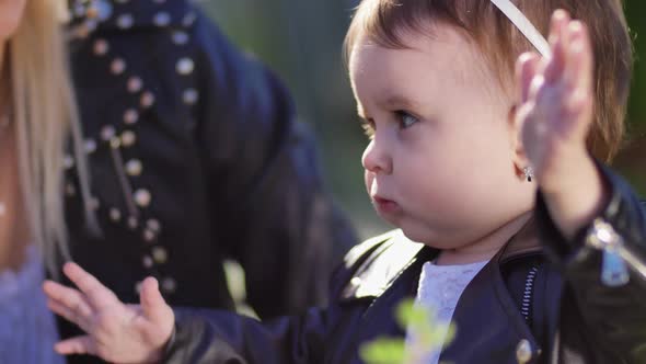 Portrait of Sweet Girl Playing with Hands