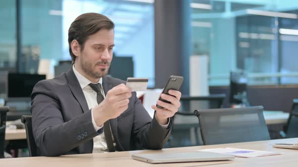 Businessman Shopping Online on Smartphone Buying