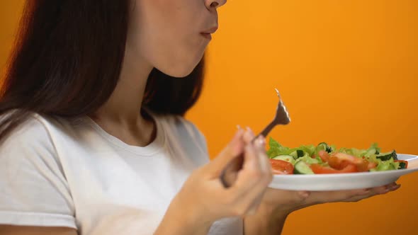 Girl Eating Tomato and Green Vegetables, Healthy Diet for Weight Loss, Vitamins