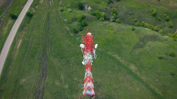 Orbit spiral aerial flight around Telecommunication antenna tower with 5G base