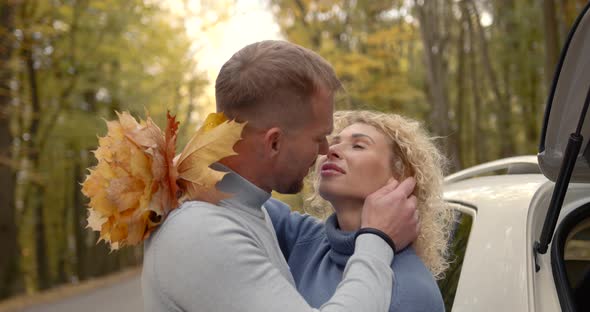 Closeup Loving Couple in Jeans on a Date in the Autumn Park