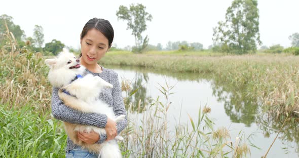 Woman be with her dog in countryside