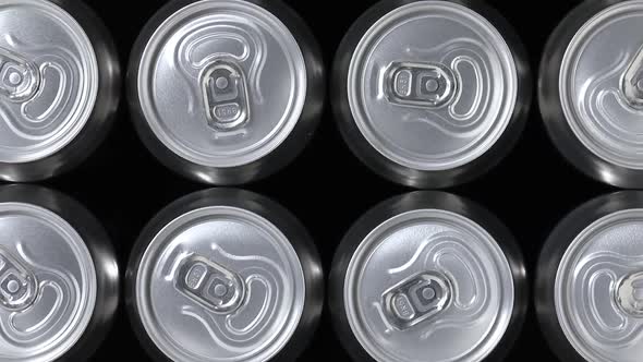 Rows of beer cans close up full frame as background 