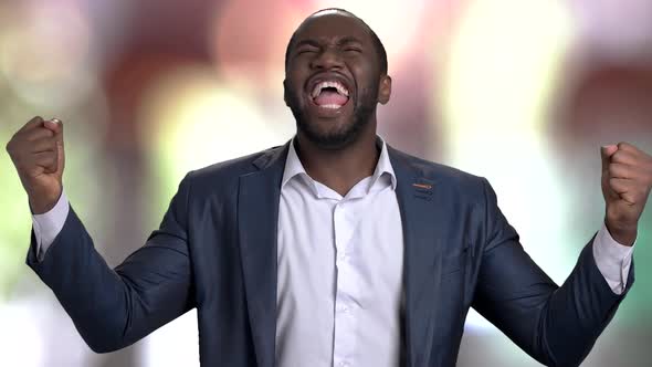 Very Happy Black Man in Business Suit Celebrating Victory.