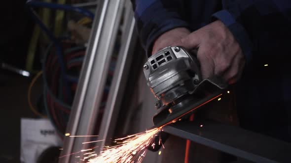 Crop worker grinding metal