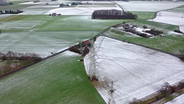 Aerial of High Voltage Power Line Pylon in the Winter