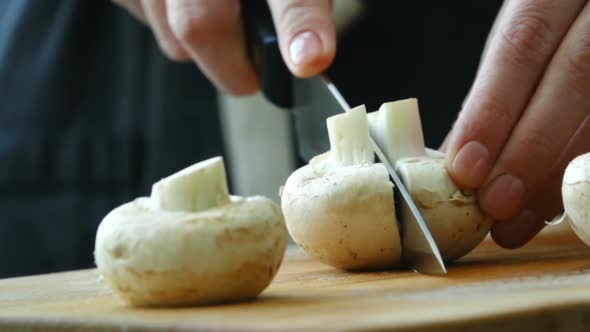 Chopping Mushrooms on Wooden Cutting Board