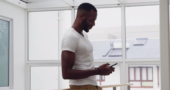 Young adult mixed race man enjoying time at home