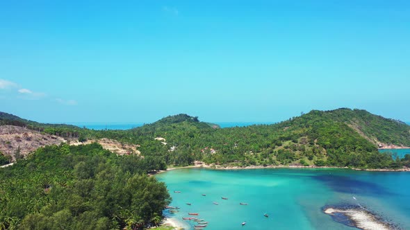 Peaceful lagoon with turquoise water and sandy Malibu beach. North coast of Koh Phangan, Thailand.