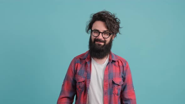 Portrait of Satisfied Bearded Man Doing Thumbs Up Gesture