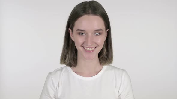 Yes, Young Woman Shaking Head To Accept on White Background