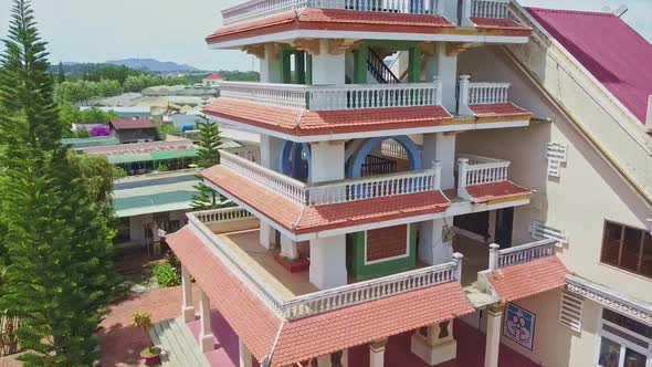 Drone Moves Down Along Modern Church Tower in Asian Style