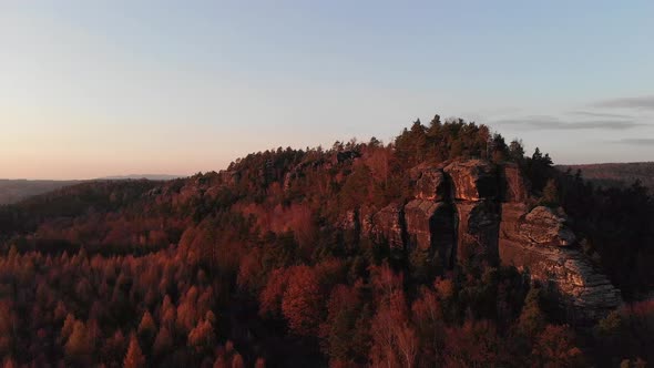 AERIAL: Flying around sandstone rock in Saxon Switzerland after sunset