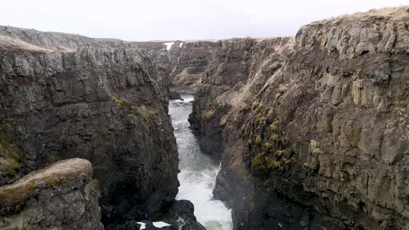 Kolugljufur Canyon with a waterfall in North Iceland