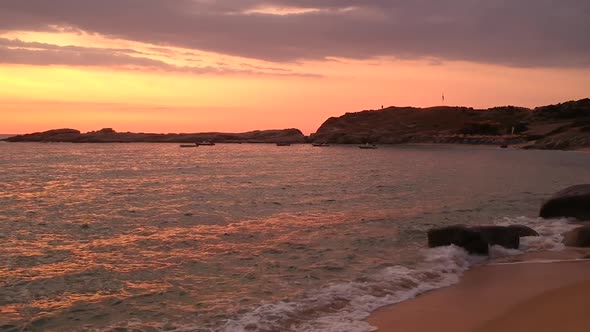 Serene Sunset on Sea Bay Sandy Beach and Boats Relaxing Scenery Drone Shot