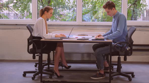 Co Workers in Office with View on Trees