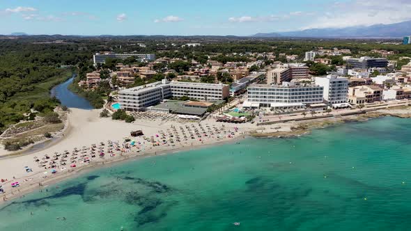 Aerial drone footage of the beach front on the Spanish island of Majorca Mallorca, Spain