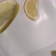 Sliced fresh lemons rain on yogurt in slow motion - High-angle shot - VideoHive Item for Sale