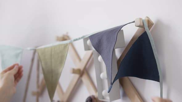 Decorative Triangular Small Flags Made By Female Tailor Indoors