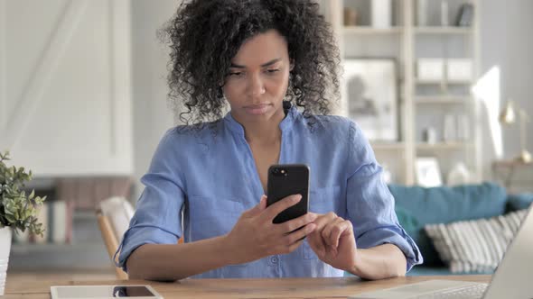 African Woman Using Smartphone Application