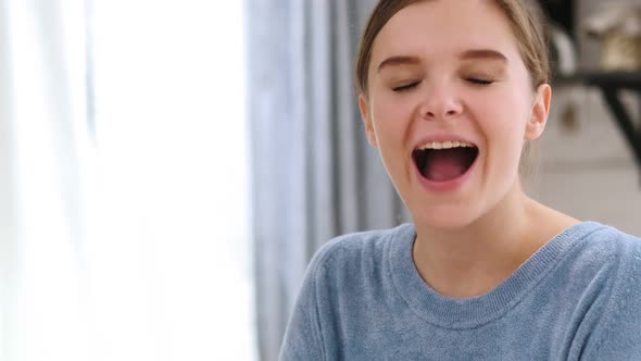 Happy Winning Woman Celebrating Success at Home