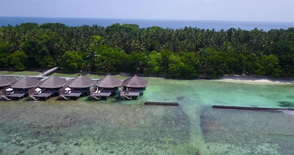 Natural aerial travel shot of a sandy white paradise beach and blue sea background in best quality 4