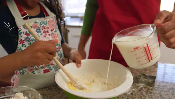 Family making Christmas cookies at home