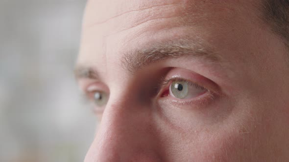 Handsome Man Looking Into Distance Close Up Face Part and Eye View