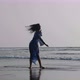 Silhouette of Young Woman Dancing with Gymnastic Elements at the Sandy Beach - VideoHive Item for Sale