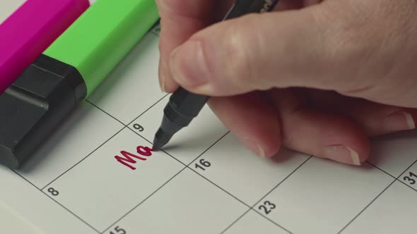 Writing Mammography on Calendar with a Black Marker