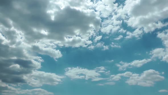 White Rain Clouds And Deep Blue Sky