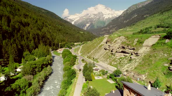 Aerial view of Lanslebourg village and snow peak mountain, Savoie, France.