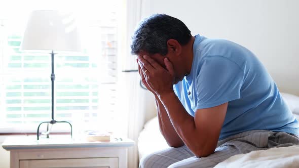 Senior man sitting in bedroom 4k