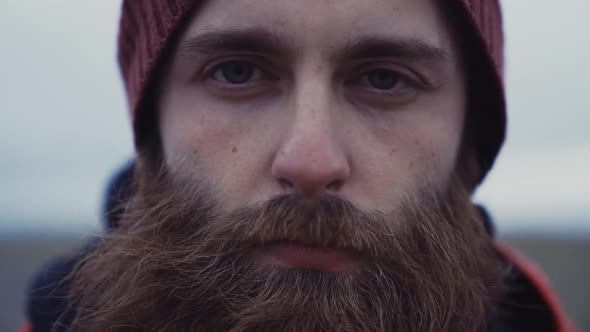Portrait of bearded traveler in outwear