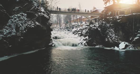 Winter Resort with Tourists on Bridge Aerial