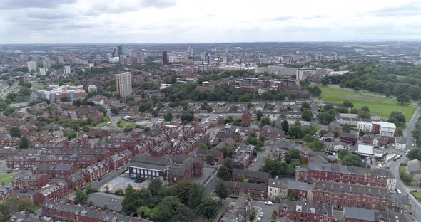 High aerial pass above Leeds City and residential areas