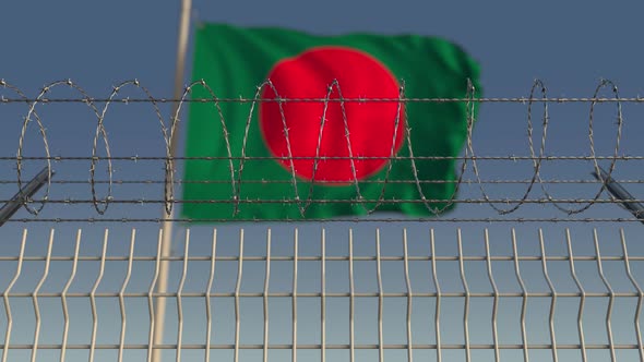 Barbed Wire Against Waving Flag of Bangladesh