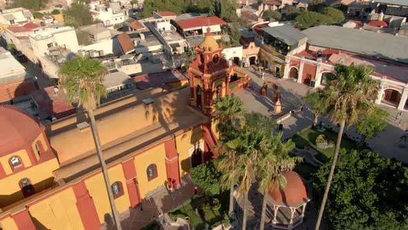 Aerial View Of Saint Sebastian's Temple And Tourists In The Main Plaza Of Bernal, Querétaro, Mexico