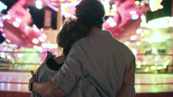 Stylish Hipster Young Couple are Standing and Looking for at Amusement Park