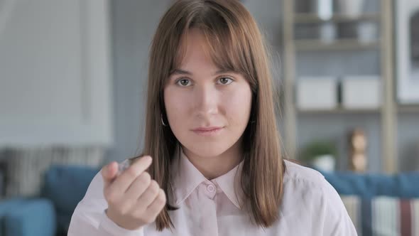 Portrait of Casual Young Girl Inviting Customers