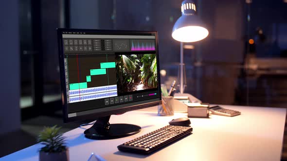 Video Editor Program on Computer at Night Office