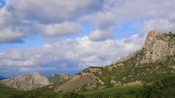 Mountains Against the Blue Sky with White Clouds.