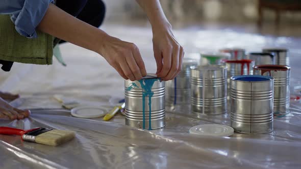 Female Hands in Studio Workshop Open Different Colors of Paint in Jar Prepare Supplies