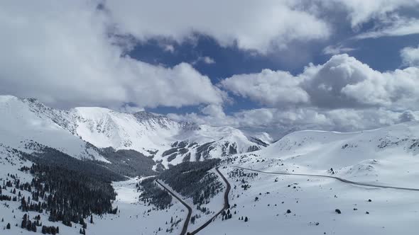 Storm brewing over the peaks on Loveland Pass, Colorado. Aerial views of mountains and highway 6.