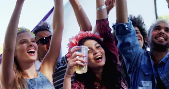 Group of friends having fun at music festival 4k