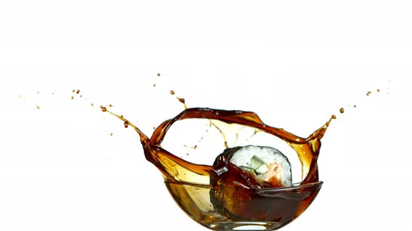 Super Slow Motion Shot of Fresh Sushi Falling Into Soy Sauce Isolated on White at 1000Fps.