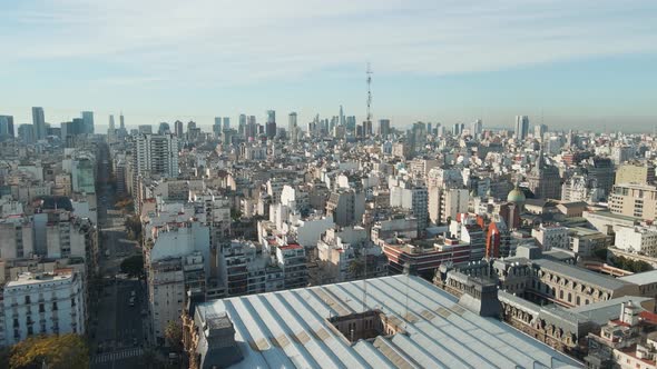 Aerial parallax flying over the Palace of Running Water with Buenos Aires city buildings in backgrou