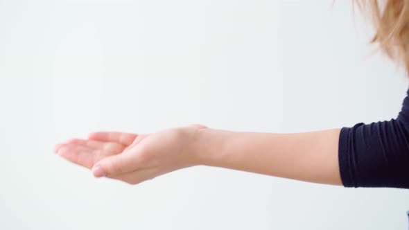 Female Applying Hand Sanitizer Gel Against White Background